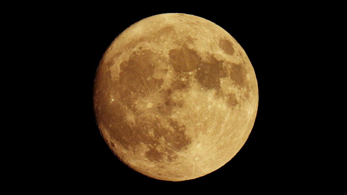 a full moon in a black sky
